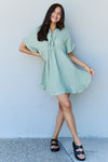 Out Of Time Full Size Ruffle Hem Dress with Drawstring Waistband in Light Sage (Online Only)